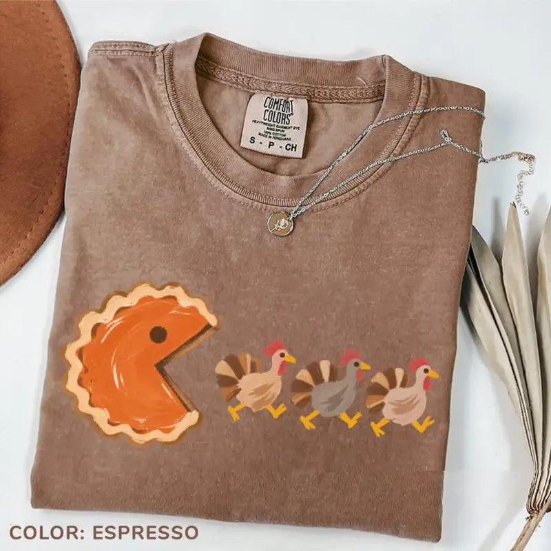 Original espresso graphic T-shirt folded with autumn accessories