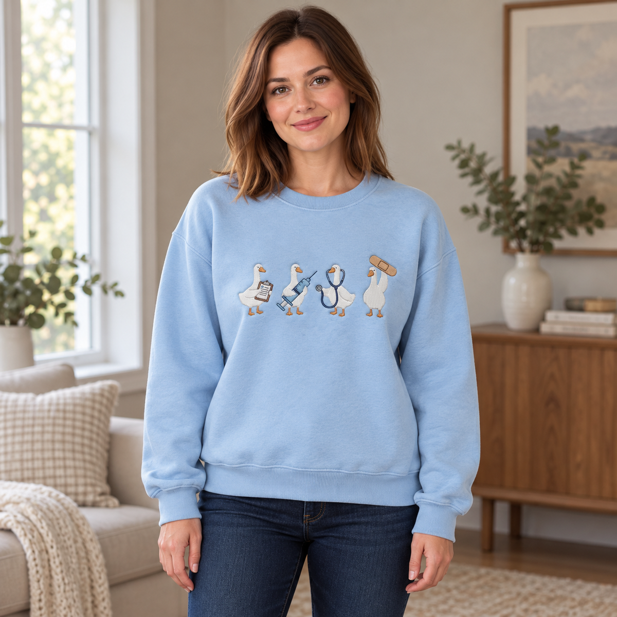 Female model wearing the light blue medical duck crewneck