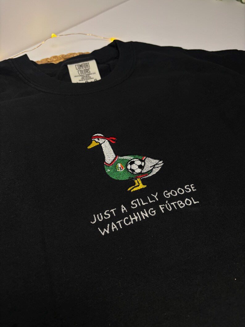 Just A Silly Goose Watching Futbol Embroidered T-Shirt – Funny Soccer Goose Graphic Tee