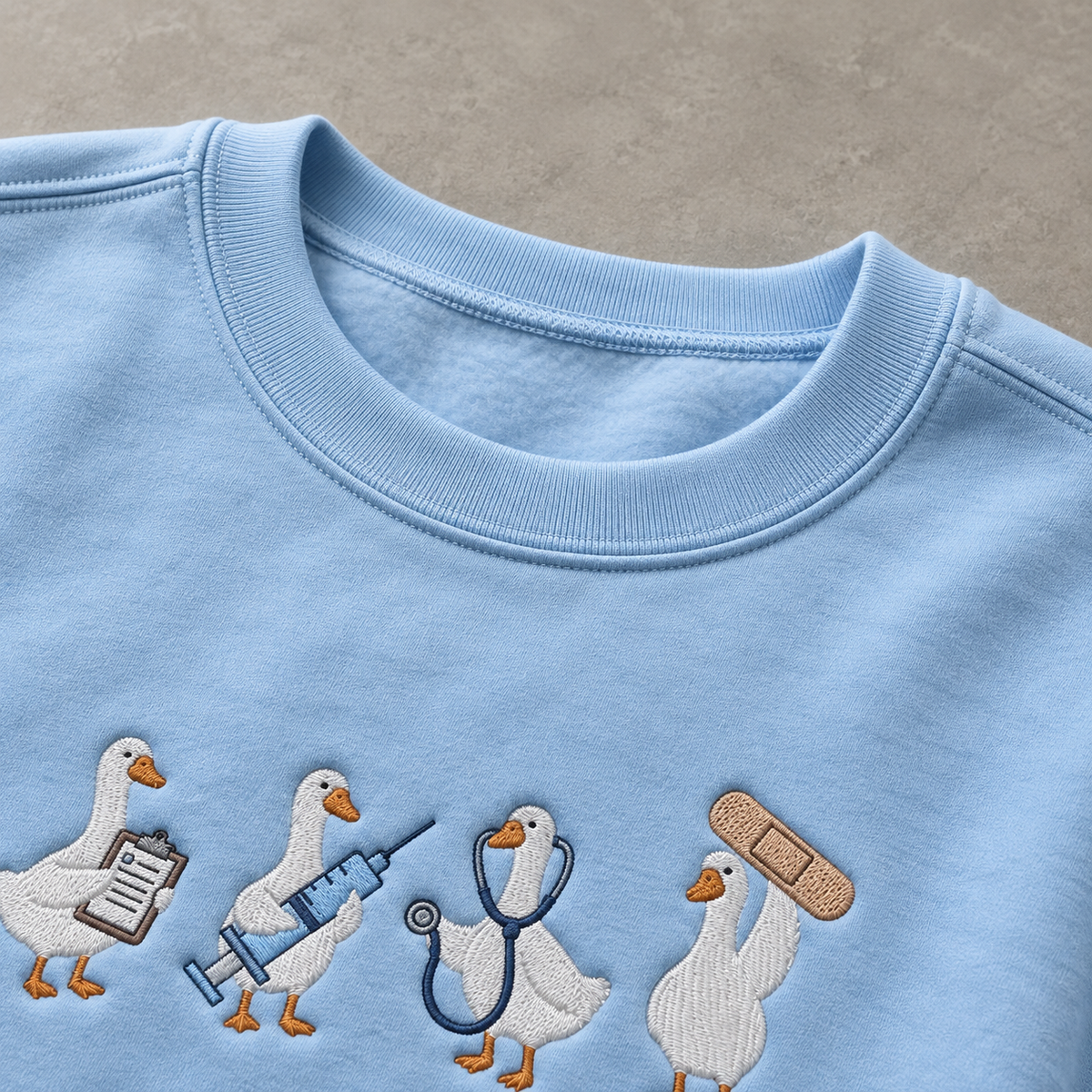Light blue ribbed crewneck and shoulder seam detail