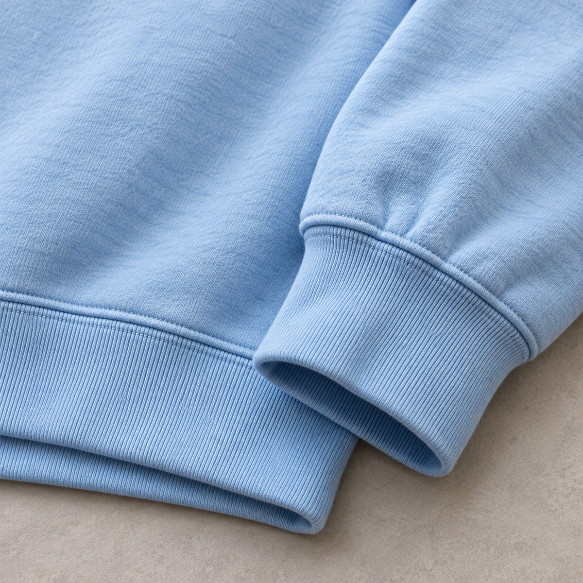 Light blue sweatshirt ribbed cuff and hem detail