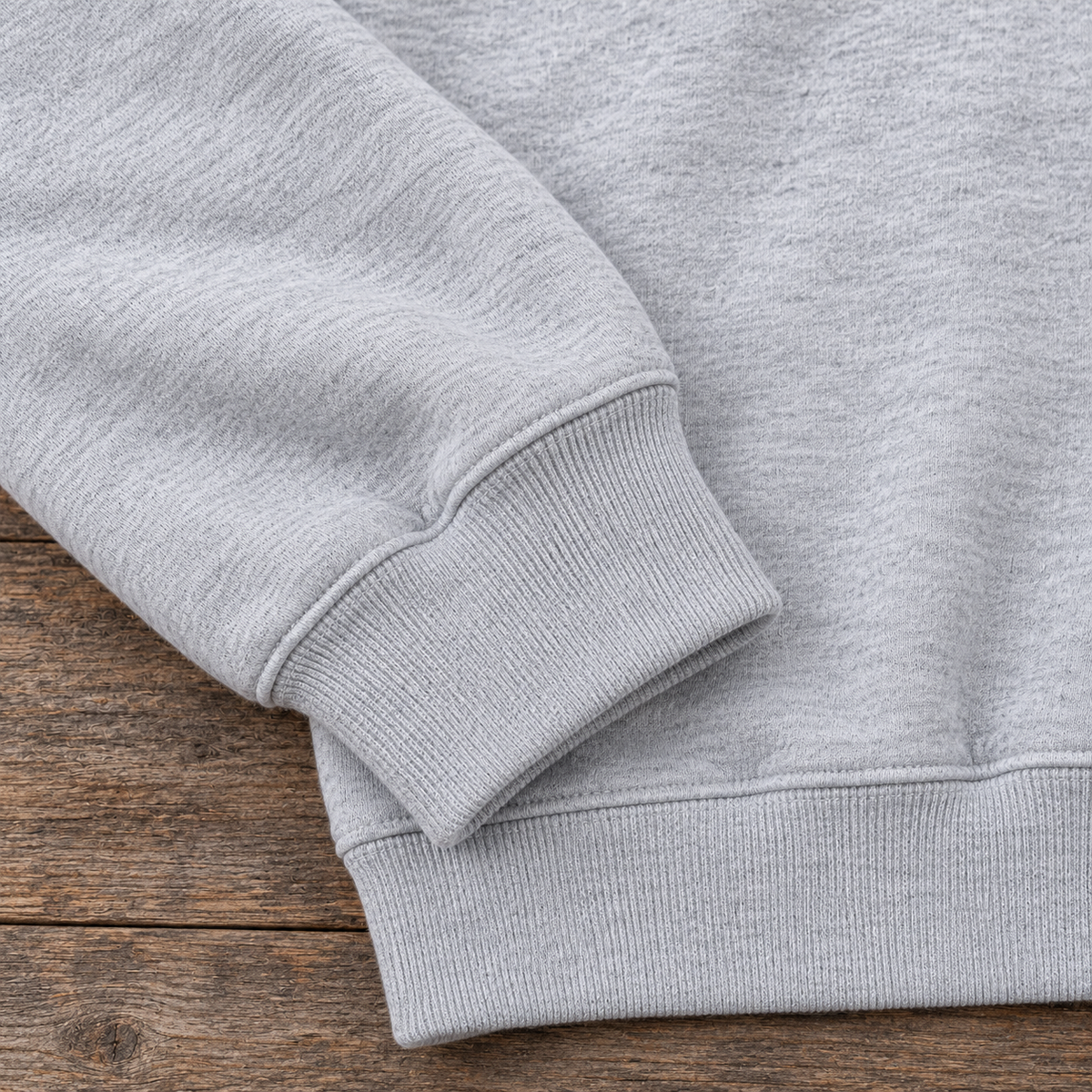 Light gray heather sweatshirt cuff and hem detail